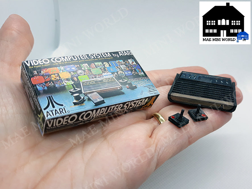 ATARI 2600 Miniature console with 2 controllers and box. Miniature 3D